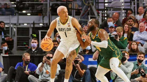 Baylor Bears forward Jeremy Sochan (1) dribbles the ball against Norfolk State Spartans guard Joe Bryant Jr. (4) during the second half during the first round of the 2022 NCAA Tournament at Dickies Arena.